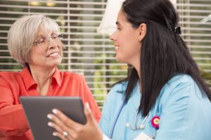 care worker with ipad