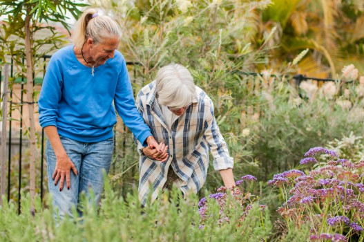 Tracey and Jan walk through Blue Care Coopers Plains Respite Care's sensory garden