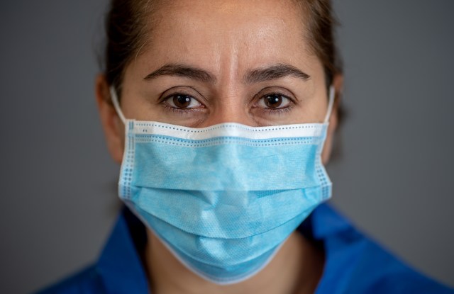 Stop the spread and Save lives campaign. Doctor wearing protection face mask. Protect yourself and others medical advice, basic protective measures against the nobel coronavirus COVID-19 Pandemic.