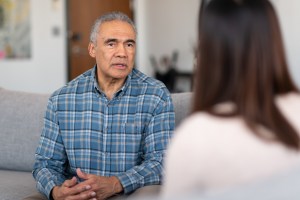 An elderly married man at couple's therapy