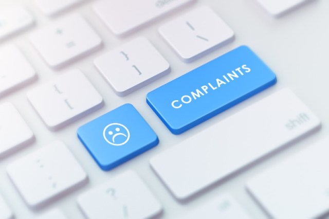modern-keyboard-with-blue-complaints-button-picture-id977758524