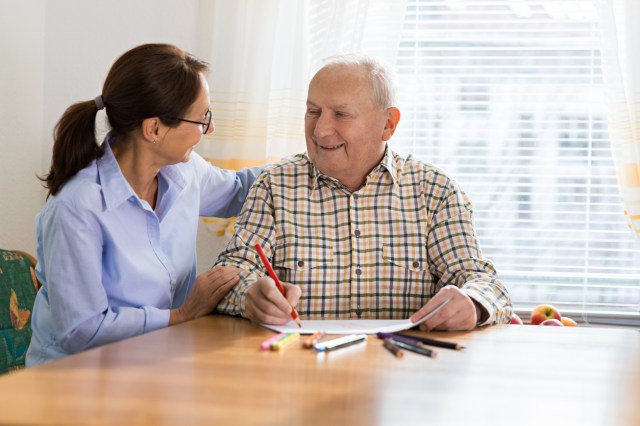 Dementia and Occupational Therapy - Home caregiver and senior adult man
