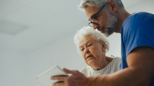 Nurse showing a patient ipad results