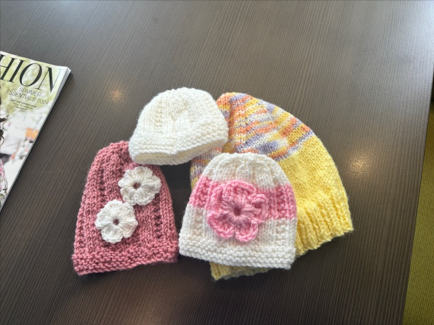 Baby beanies made by TriCare Retirement residents