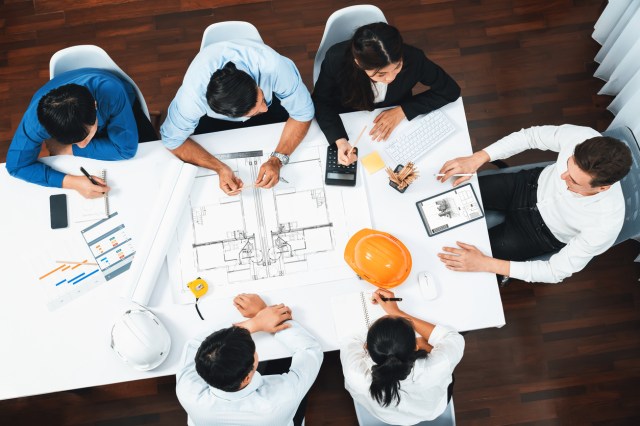 group of civil engineers and clients working on project