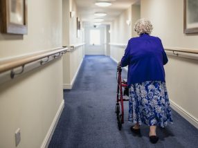 Senior Woman with Walker in a Care Home