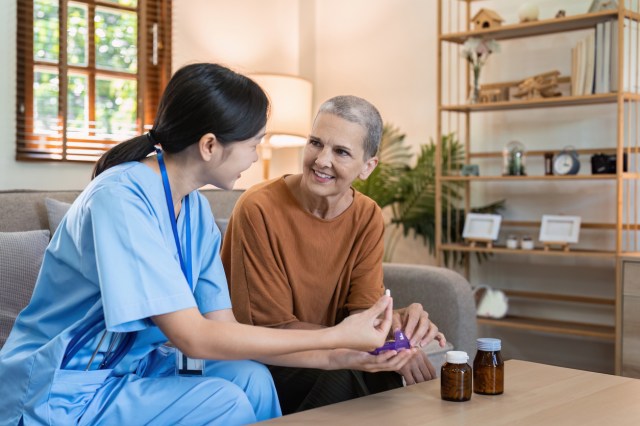 Female doctor are advise medication and vitamin daily to elderly patient