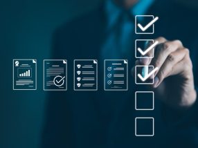 Quality Assurance and Document Control with Checklist Icons. Businessman mark off items on digital checklist, representing quality assurance and document control processes, verification and compliance