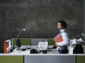 Businessman walking with documents